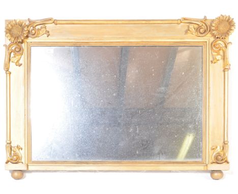 A Regency 19th century gilt wood over mantel mirror. The rectangular mirror with cavetto moulded frame having stunning sunflo