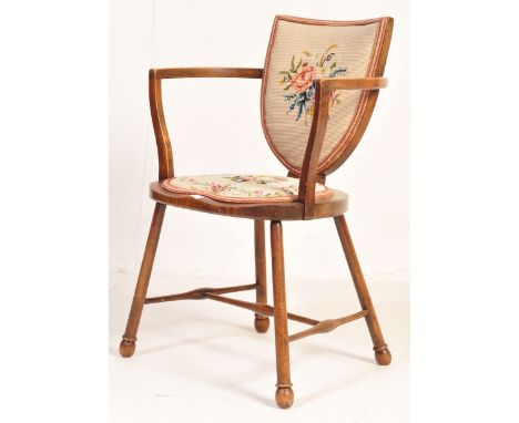 A late 19th century Victorian goldsmith beech wood Windsor chair. Raised on turned legs with stretchers having overstuffed se