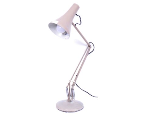 A retro vintage mid 20th century desk lamp in the manner of Herbert Terry having a conical light shade over a three arm suppo