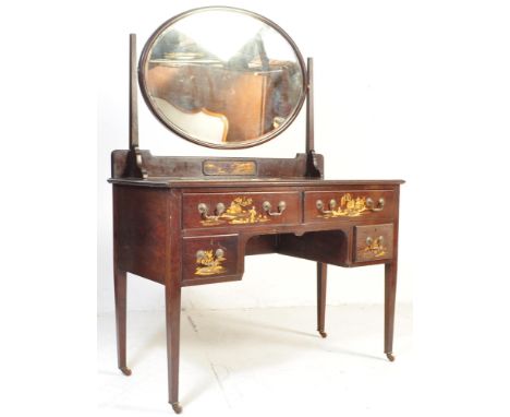 An Edwardian mahogany dressing table. The dressing table being chinoiserie decorated with Asiatic scenes to the series of dra