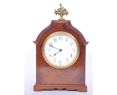 An Edwardian era early 20th century Buren bracket walnut clock of neo-classical design with brass fruit vase finial and Swiss