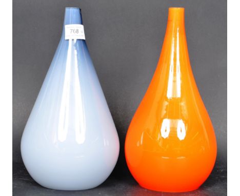 A pair of retro mid 20th Century Danish glass lamp bases in the manner of&nbsp;Jacob E. Bang for Holmegaard. One finished in 