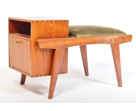 A mid century retro teak wood telephone table. Raised on shaped angular supports having a show wood frame with end fall front