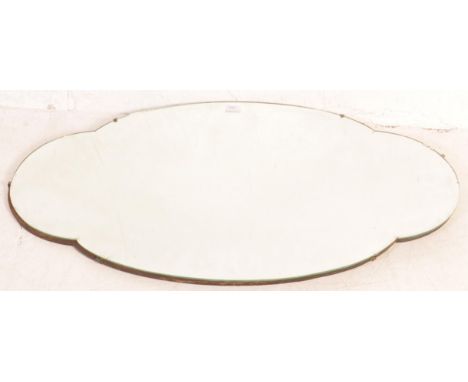 A 1930's Art Deco ovoid shaped bevelled edge wall mirror. Large frameless mirror, bevelled edgings with back panel verso and 