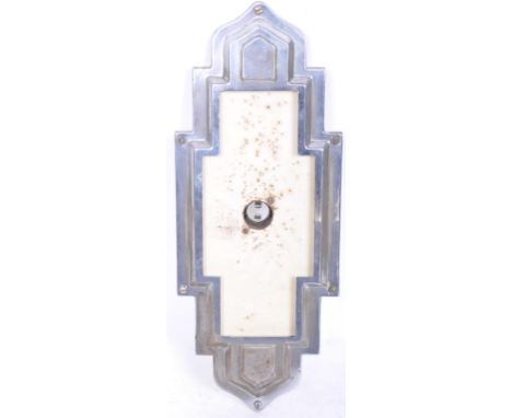 A 20th century Art Deco chrome metal light fitting having raised geometric decoration with chrome and Bakelite bulb holder.