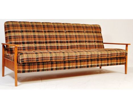 A retro vintage mid 20th century circa 1970s three person sofa / day bed having a teak show wood framed upholstered in period