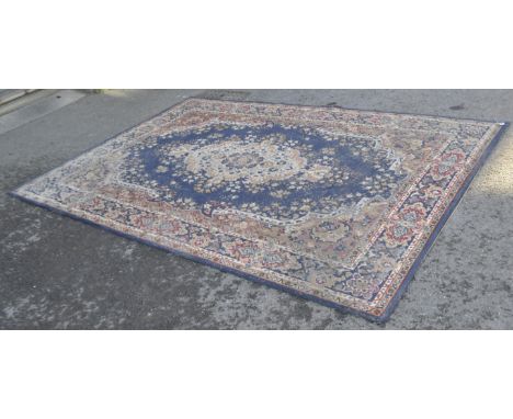 A 20th century Persian Islamic wool rug carpet having a central medallion surrounded by floral and geometric patterns. Measur