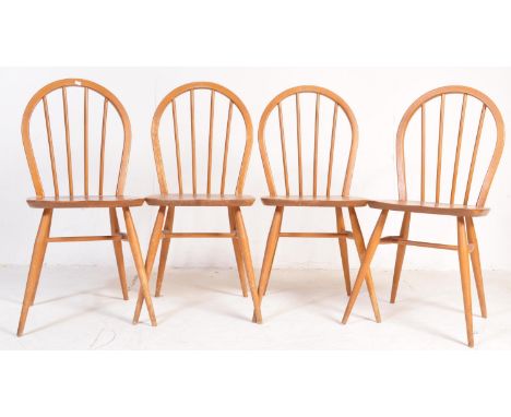 
Lucian Ercolani for Ercol Furniture. A&nbsp; set of 4 20th century Ercol beech and elm wood Windsor pattern dining chairs. T