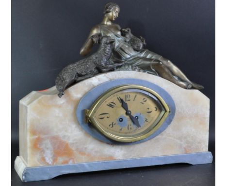 S. M. Of Paris - An original 1920's Art Deco French white marble and alabaster mantel clock having a spelter figurine of a ma