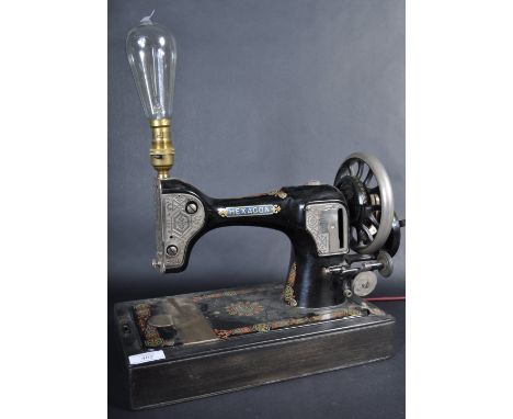 An upcycled vintage early 20th Century converted Hexagon table top sewing machine lamp with original stencilled decoration an