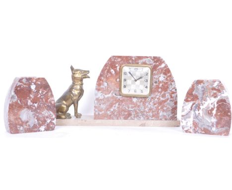 A vintage 20th Century Art Deco three piece&nbsp;marble clock garniture set&nbsp;with the clock having a domed red marble sur