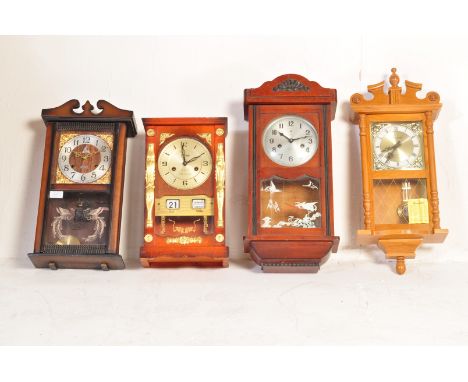A collection of four vintage 20th century wall clocks of typical form having glazed fronts with circular clock faces to inclu