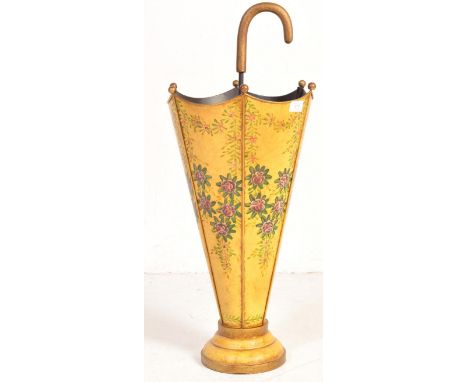 
A retro vintage 20th century umbrella shaped stand having curved umbrella handle to the top, shaped metal body decorated wit