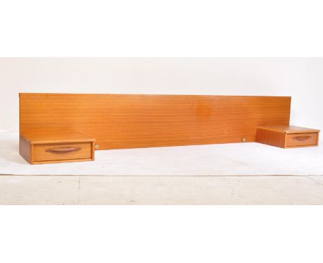 A mid century / retro 20th century teak wood headboard having large panel back with twin single drawers having recessed handl