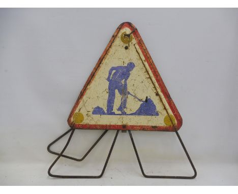 A triangular enamel road sign for road works on folding stand, 24 x 21 1/2" (measurements for sign only).