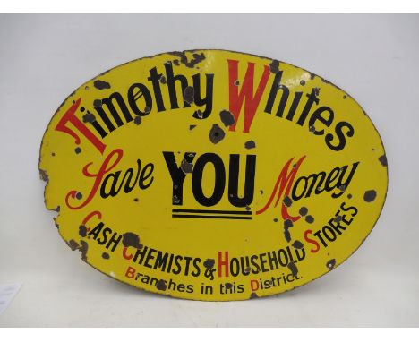 A Timothy Whites Cash, Chemists and Household Stores oval enamel sign, 35 1/2 x 25".