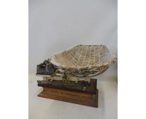 A set of Allen &amp; Hanburys Limited scales with weights.