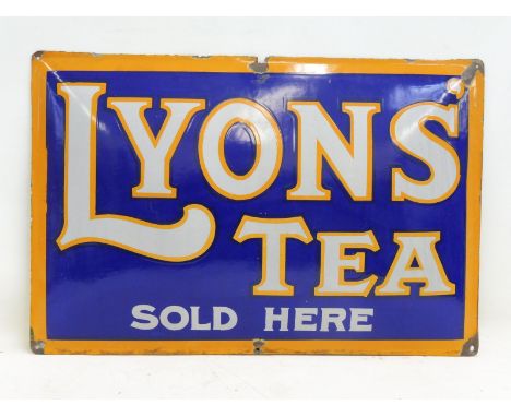 A Lyons' Tea Sold Here convex rectangular enamel sign in good condition, 29 1/2 x 19 1/2".