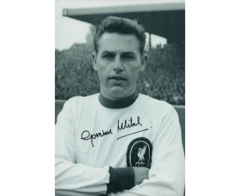 Gordon Milne signed 12x8 inch black and white photo pictured during his playing days with Liverpool. F.C. Good condition. All