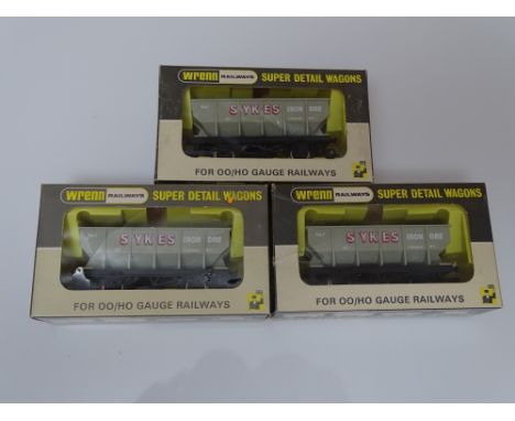 OO Gauge: A group of rarer WRENN wagons to include: 3 x W5082 'Sykes' Hopper Wagons - VG / E in VG boxes