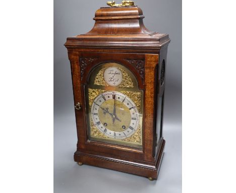 A George III-style mahogany mantel clock, 5.75 inch arched dial, gong striking movement, with key and pendulum, height 49cm