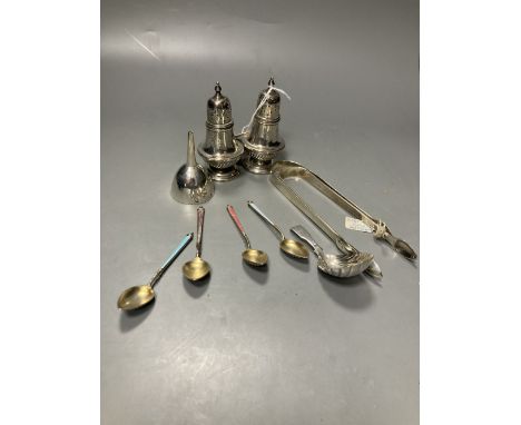 A pair of late Victorian silver pepperettes, London, 1891, 95mm, A George III silver caddy spoon, two pairs of silver sugar t