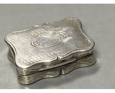 A Victorian engine turned silver vinaigrette, maker's mark rubbed, Birmingham, 1858, 27mm.CONDITION: Engraving quite tired to