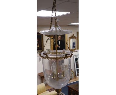 A pair of three light hall lanterns, cast with anthemions, height 63cm
