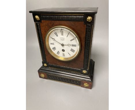 A French ebony and walnut mantel clock, height 25cm, 21cm at the base bears a Benson mark
