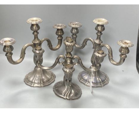 An early 20th century German 925 standard four branch, five light candelabrum, 23.3cm, weighted? and a pair of similar German