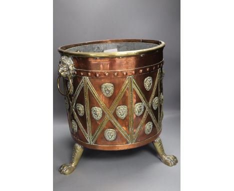 A Victorian copper and brass cylindrical coal box, with lion-mask ring handles, wood liner, 38cm