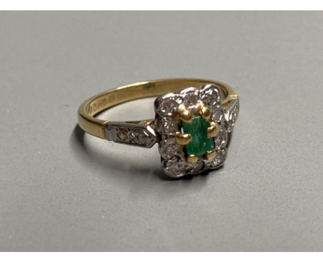 A modern 18ct gold, emerald and diamond rectangular cluster ring, with diamond set shoulders, size J, gross 2.7 grams.CONDITI