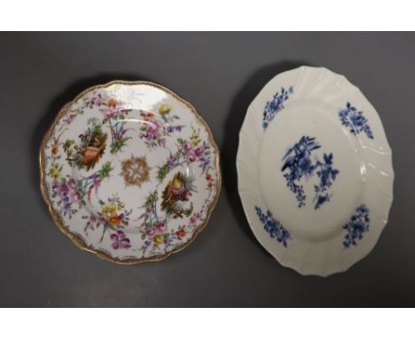 An 18th century Tournay or Arras moulded plate and a 19th century Meissen plate painted with two scenes of lovers and flower 