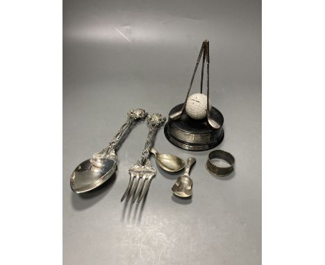 Two 19th century caddy spoons, including one silver and one Dutch white metal, silver napkin ring, a pair of Continental whit