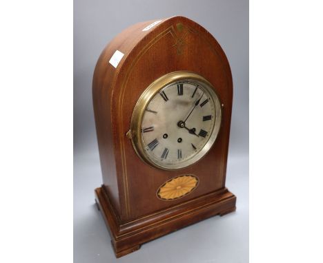 A Victorian mahogany and cut brass chiming lancet mantel clock, 6 inch silvered dial and French musical movement striking on 