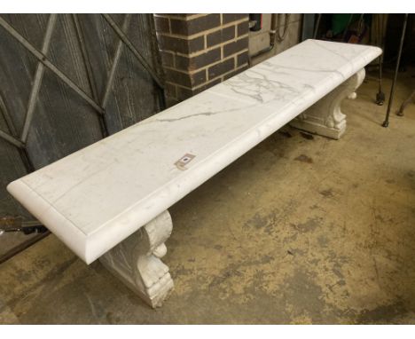 An early 20th century Italian carved white marble bench, with later marble top, width 182cm depth 45cm height 48cm