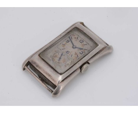 A 1930s Rolex Prince manual wind silver cased wristwatch head, 25.5mm at widest and 42.6mm high, rectangular face with two di