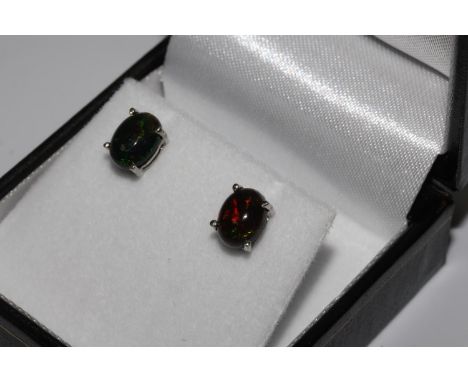 Pair oval black opal studs set in silver 