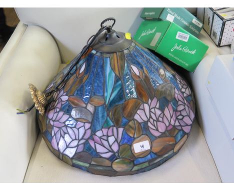 A Tiffany style leaded glass ceiling light, depicting pink flowers on a blue ground, 50 cm diameter 