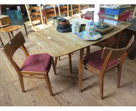 A 1950s G-Plan 'Brandon' range teak dining room suite, comprising a drop leaf table with four dining chairs, a sideboard with