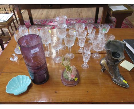 A set of six swag cut wine goblets, six brandy glasses, other drinking glasses and glassware, a purple cylindrical vase, tabl