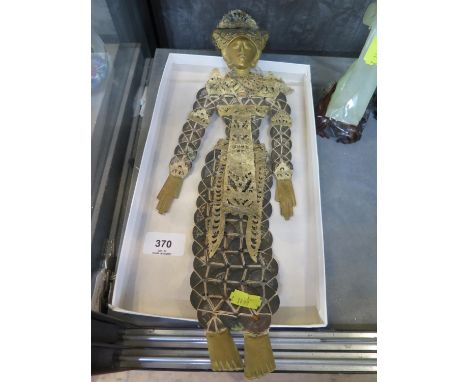 A Thai puppet style figure, made from coins with applied vellum and gilded timber face, hands and feet, 40 cm long 