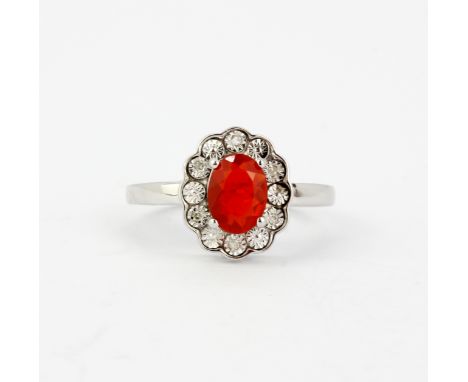 A 925 silver ring set with an oval cut fire opal, approx. 0.79ct, and small diamonds, (O). With certificate.