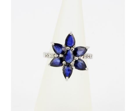 A 925 silver ring set with pear cut sapphires, approx. 2.97ct total, and cubic zirconia's, (K).With certificate.