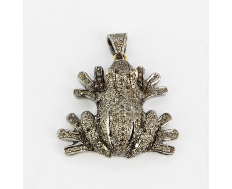 A large white and yellow metal diamond set frog shaped pendant with ruby eyes, L. 4cm.