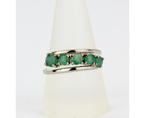 A 925 silver crossover ring set with emeralds,  ring size S.5.
