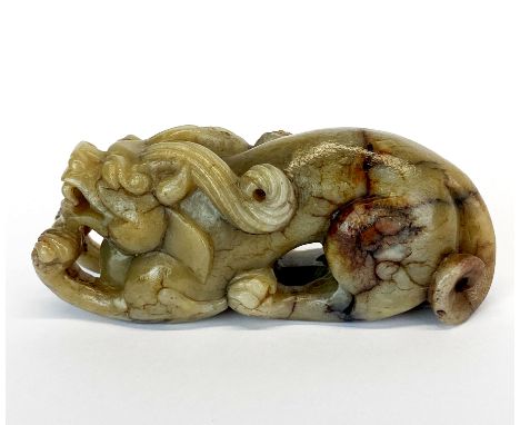 A Chinese carved jade / hardstone figure of a young dragon, L. 10.5cm. H. 4.4cm.