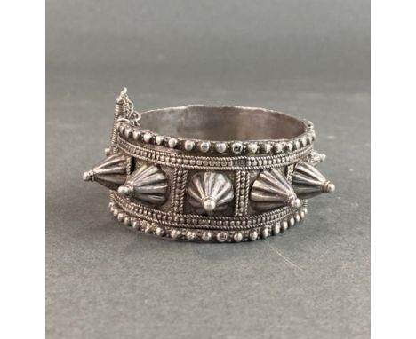 An Eastern white metal bangle with an Arabic hallmark. One pin missing.