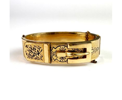 A Victorian rolled gold mourning bangle, W. 1.6cm.