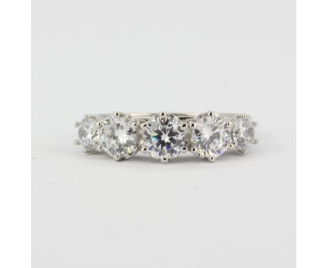 A 925 silver half eternity ring set with large round cut cubic zirconia's, (R).